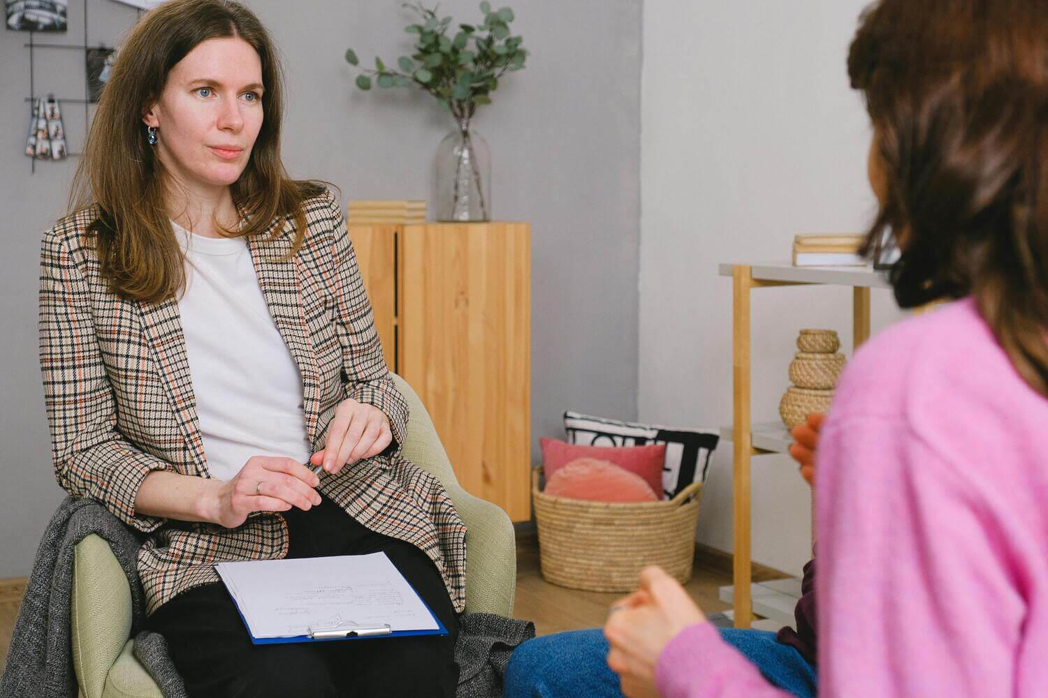 Therapist talking with patient during counseling session